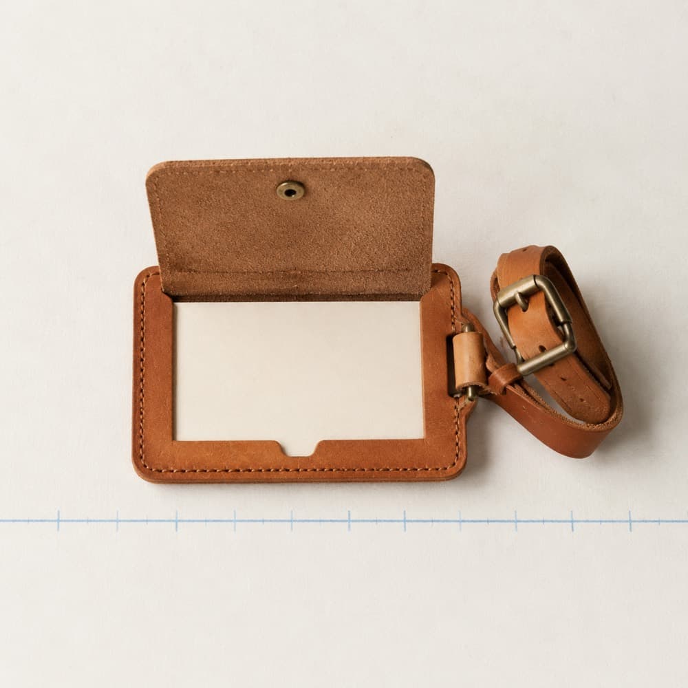 Luggage Tag with Privacy Flap — The information side stays covered until someone lifts it.