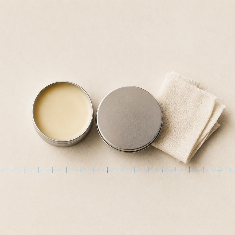 Travel Care Cloth & Balm Duo — A colourless balm and a cotton cloth. Test a small area first.